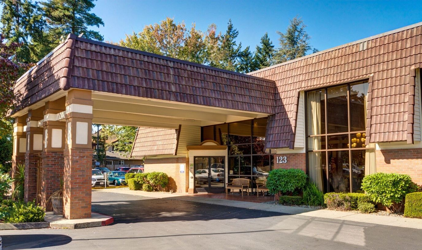 Entrance of a senior living facility with a covered entrance