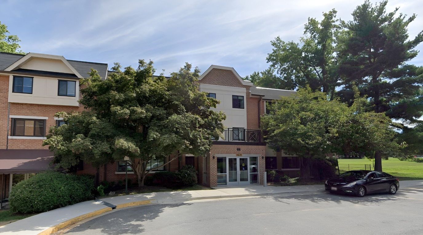 Exterior view of Bauer Park facility with surrounding trees