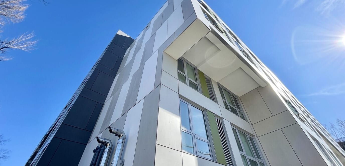 Modern building exterior with large windows and strong angles