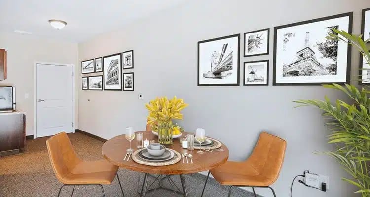 Dining area with a round table and flower centerpiece