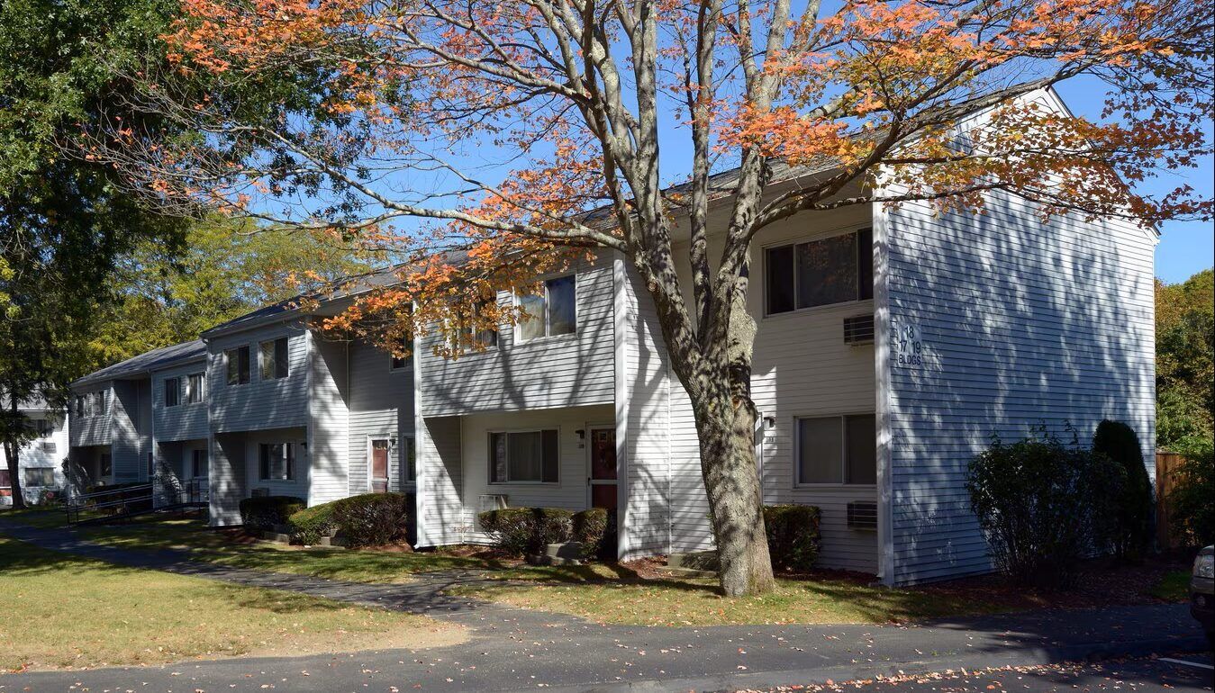 Exterior view of residential building with autumn tree