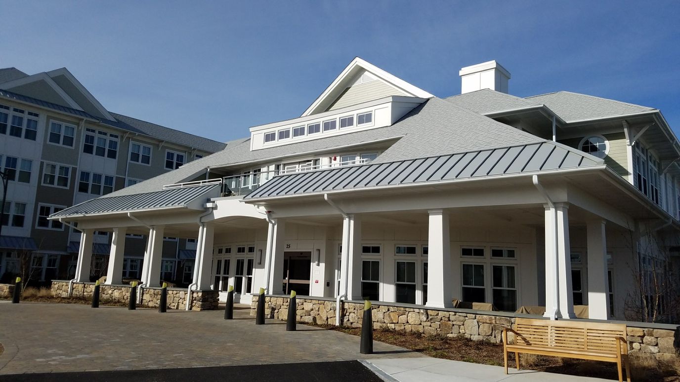 Exterior view of a senior living facility with welcoming entrance