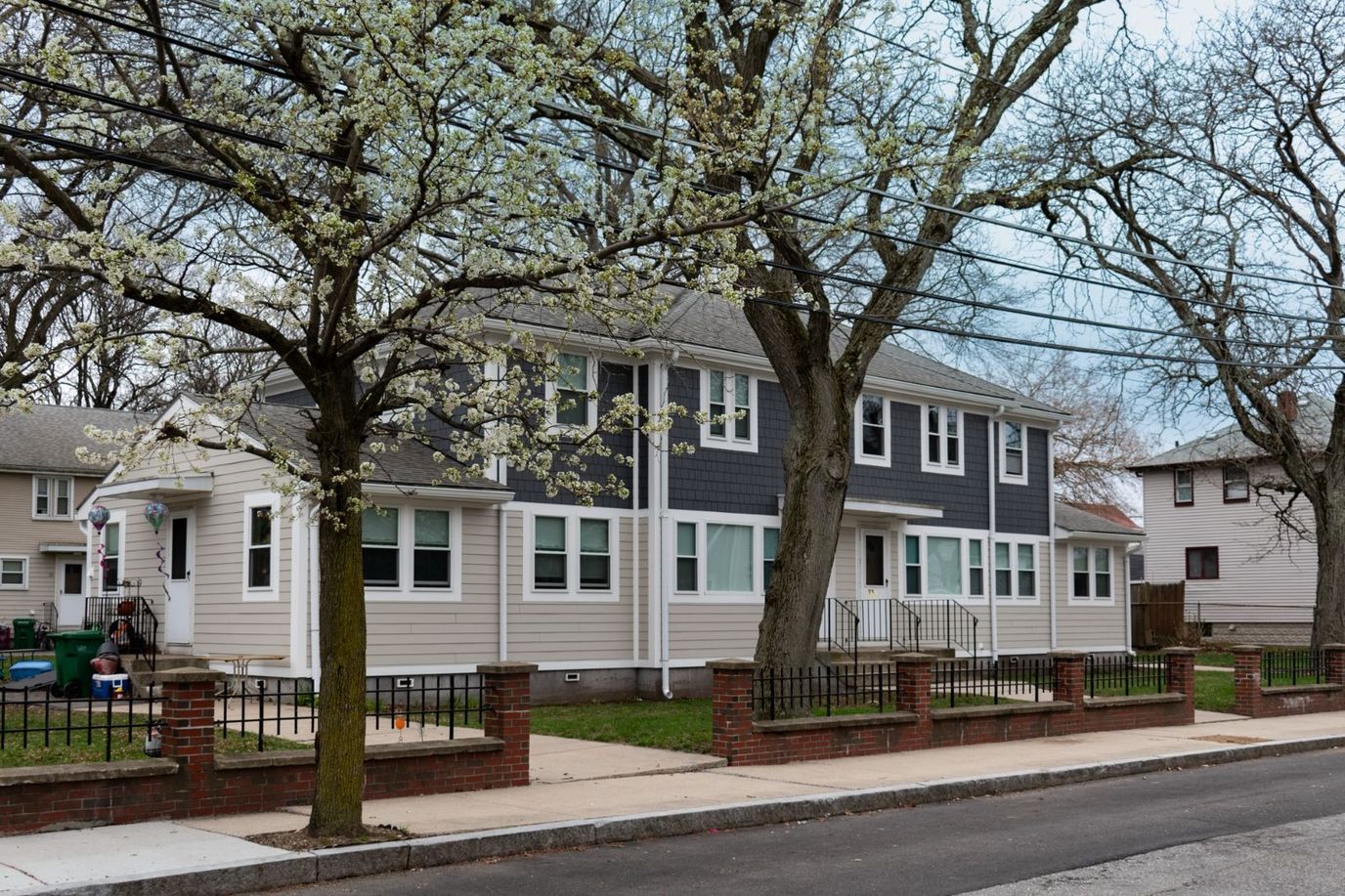 Exterior view of a senior living facility with trees