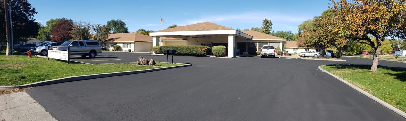 Exterior view of Country Living Retirement Homes with parking area