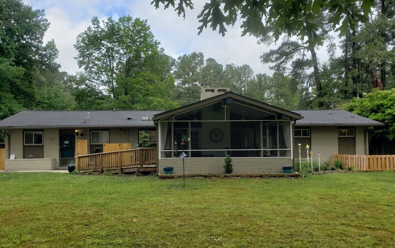 Exterior view of Rockbridge Senior Home Living with garden