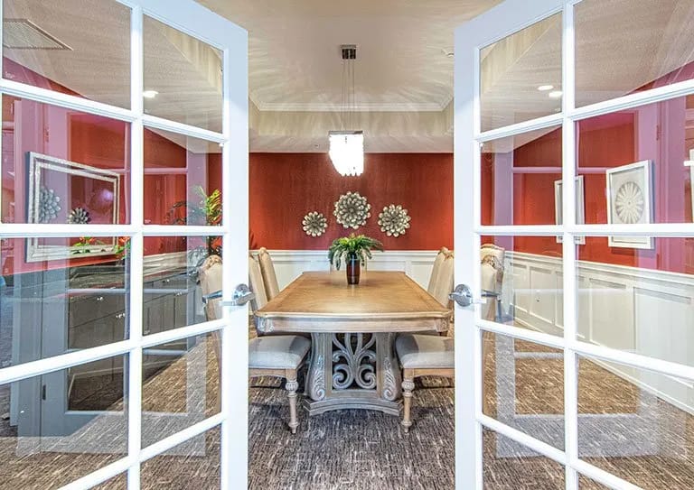 Interior dining room with a large table and decorative elements
