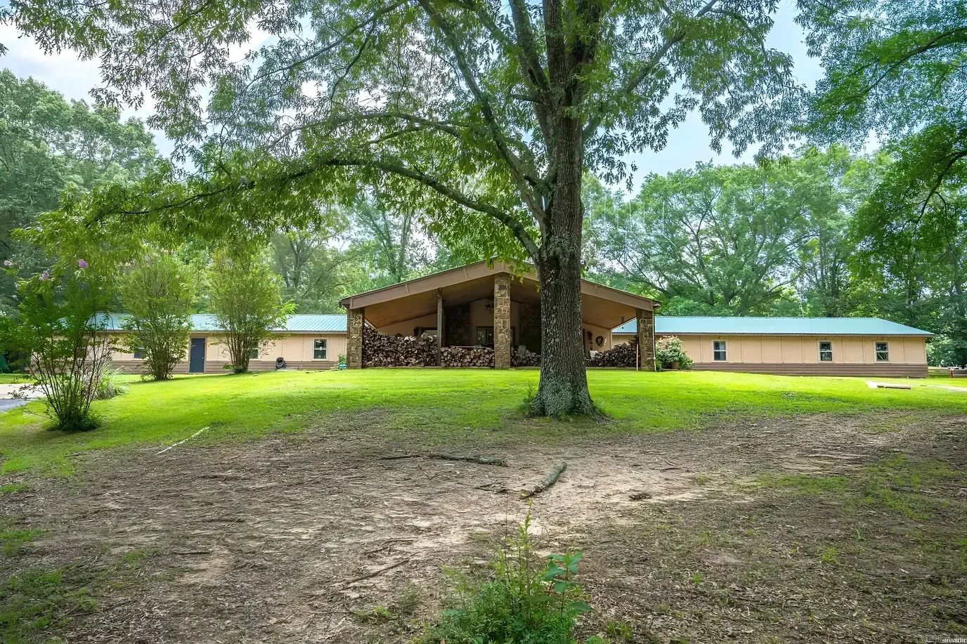 Exterior view of Village Manor surrounded by greenery