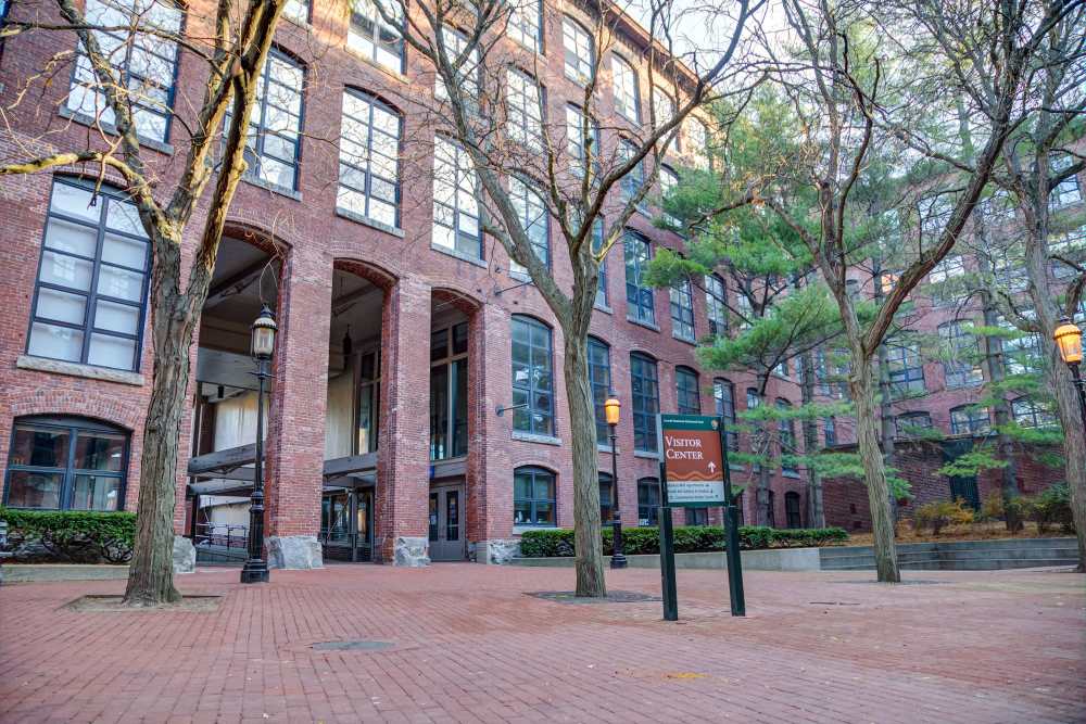 Building exterior of Market Mill Apartments with trees
