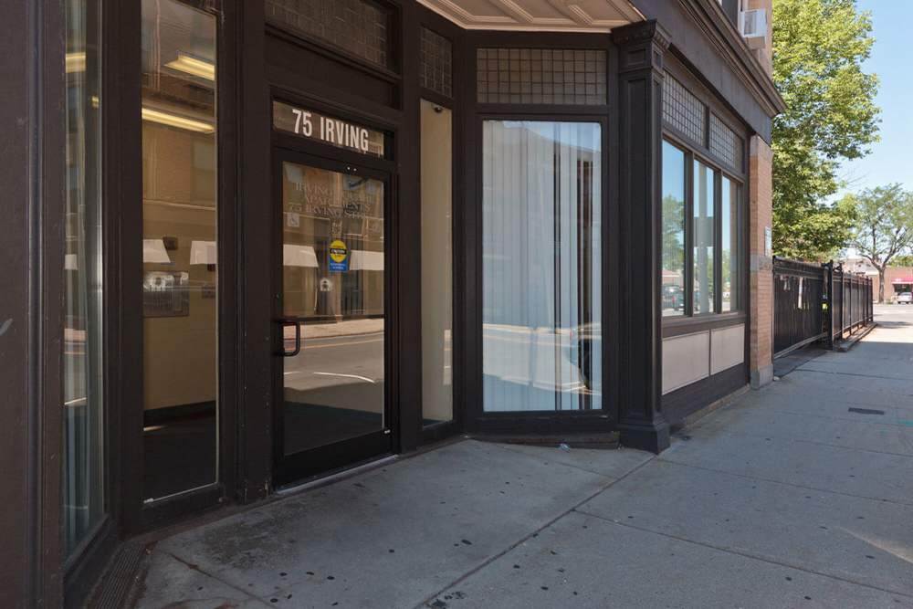Exterior view of the entrance at Irving Square Apartments