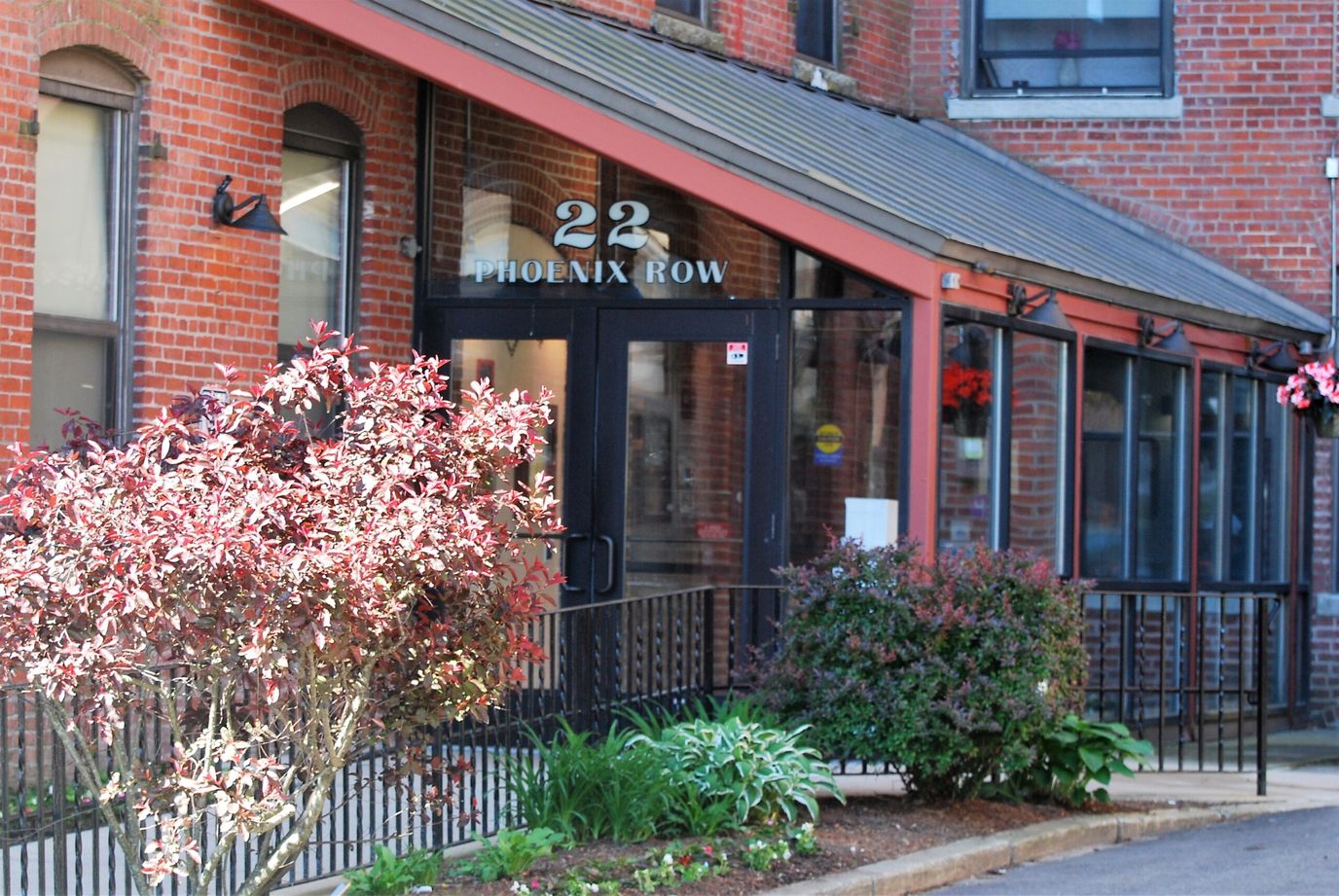 Exterior view of a building entrance with landscaping