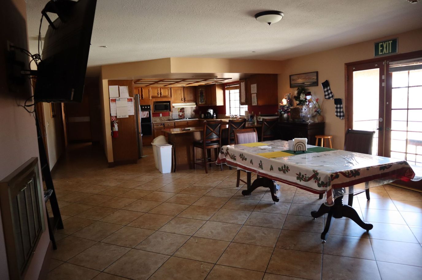 Bright common area with seating and kitchen access