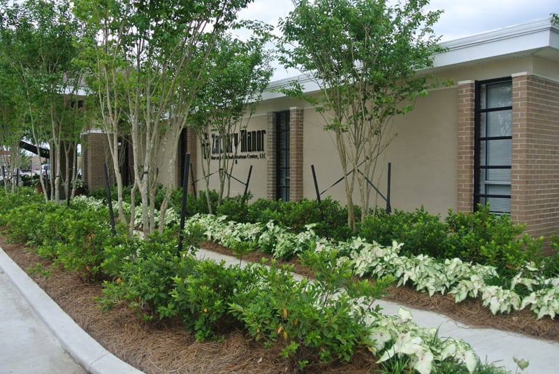 Exterior view of Zachary Manor with landscaped garden