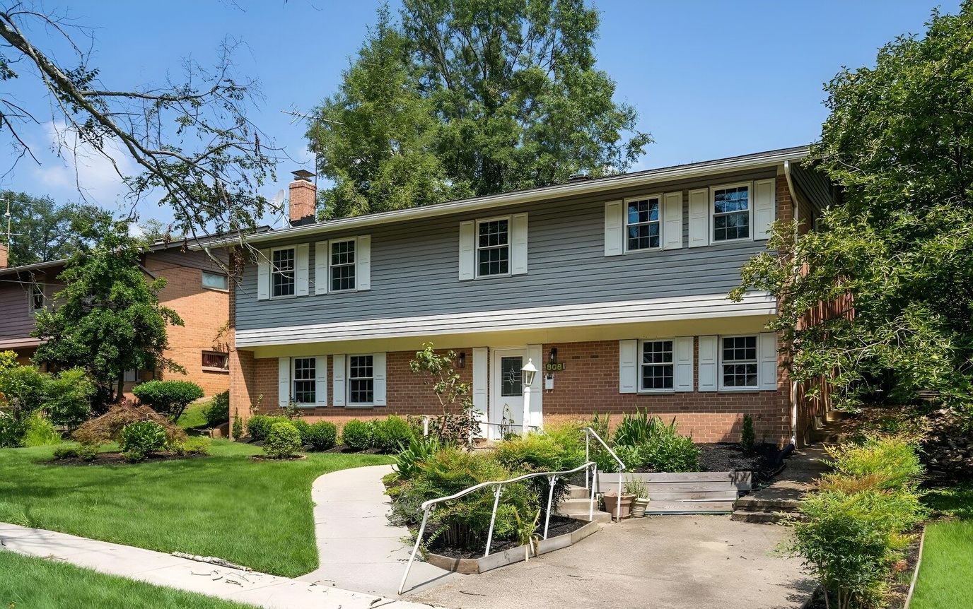 Exterior view of a home with a landscaped yard