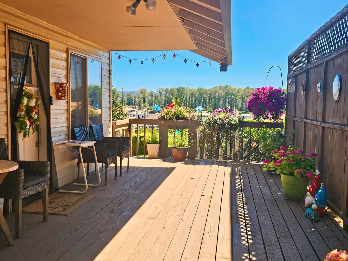 Outdoor patio with flowers and seating area