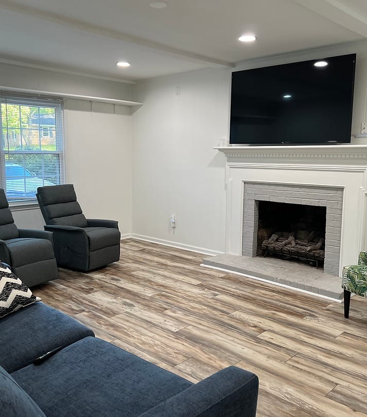 Bright interior common area with seating and a television