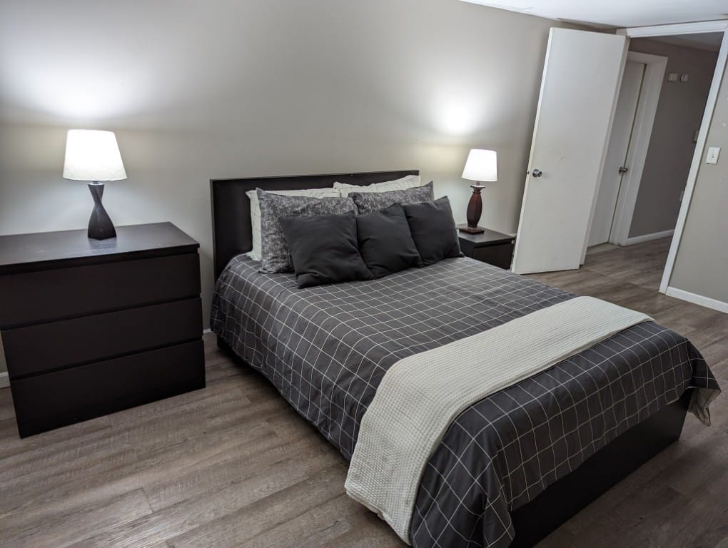Cozy resident room with a bed and dresser