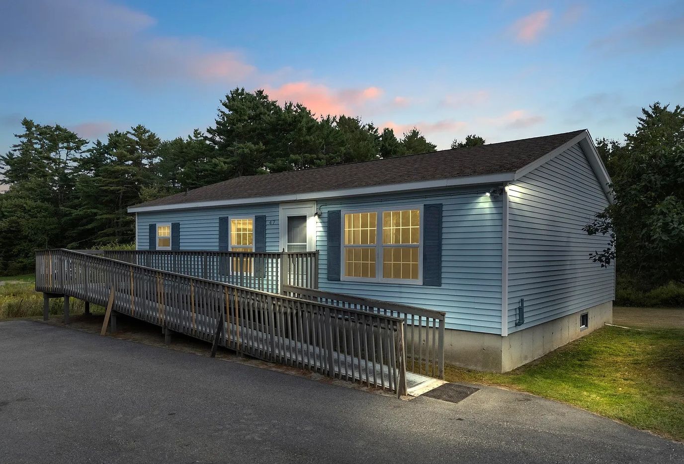 Exterior view of a blue building with ramp access