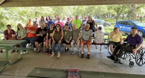 Group photo of residents enjoying an outdoor gathering