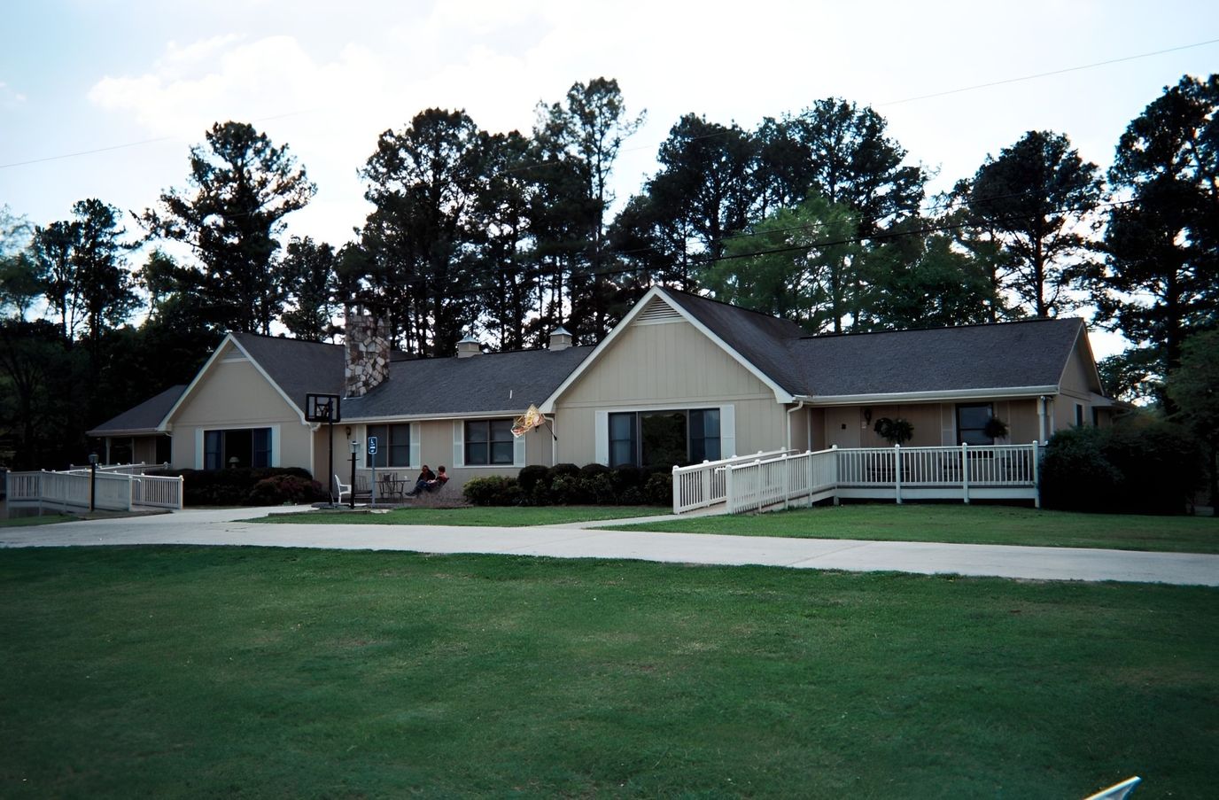 Exterior view of Lighthouse Personal Care Home surrounded by greenery