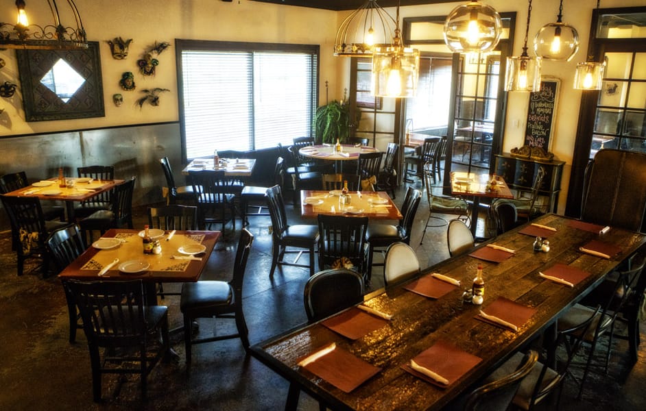 Interior dining area with tables and decorative lighting
