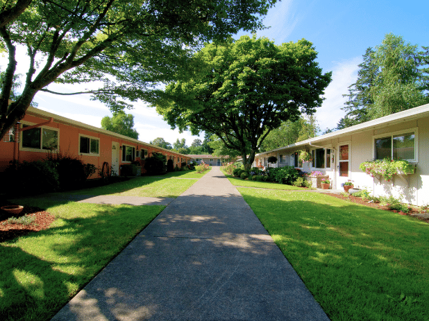 Pathway with residential buildings and greenery