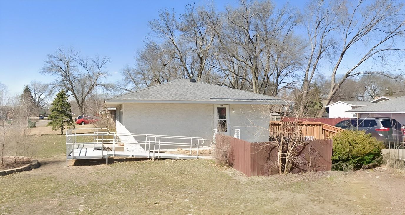 Exterior view of a facility building with outdoor area