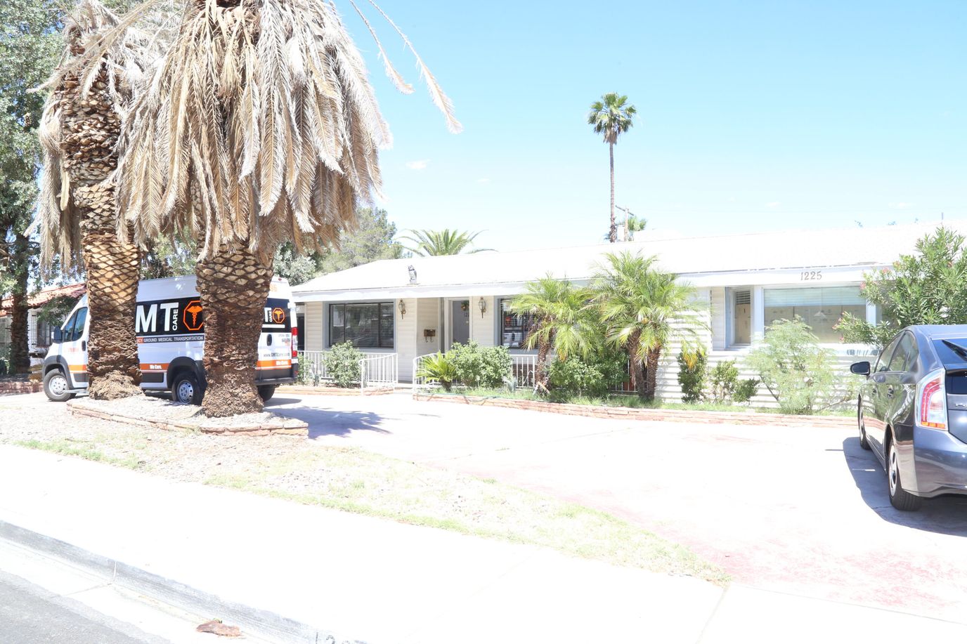 Exterior view of the facility with palm trees.