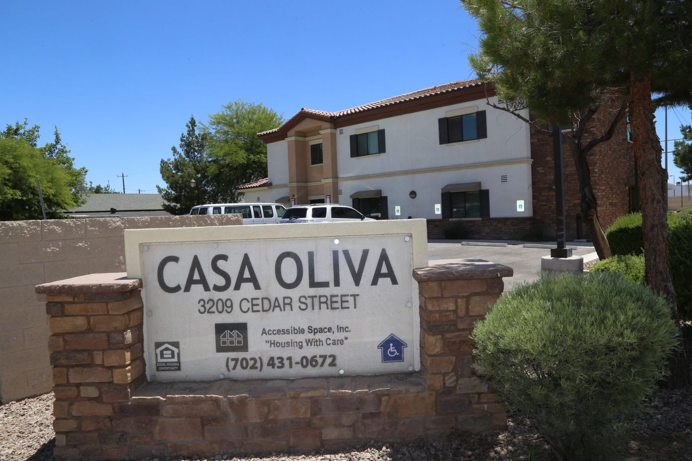 Exterior view of Casa Oliva with sign