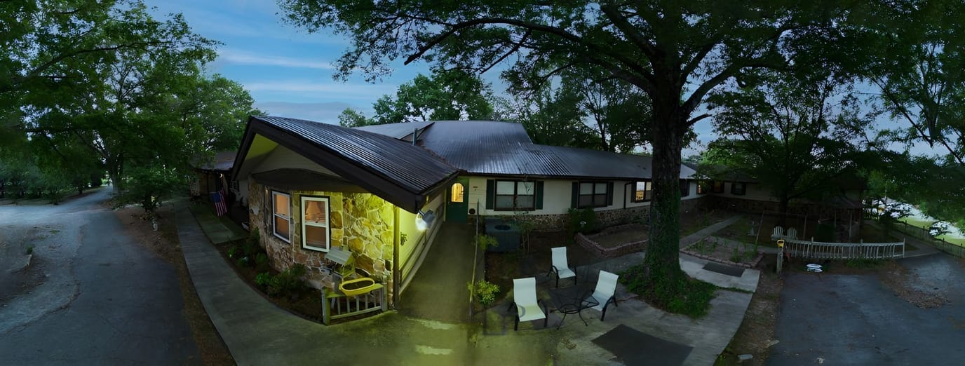 Exterior view of a senior living facility in the evening
