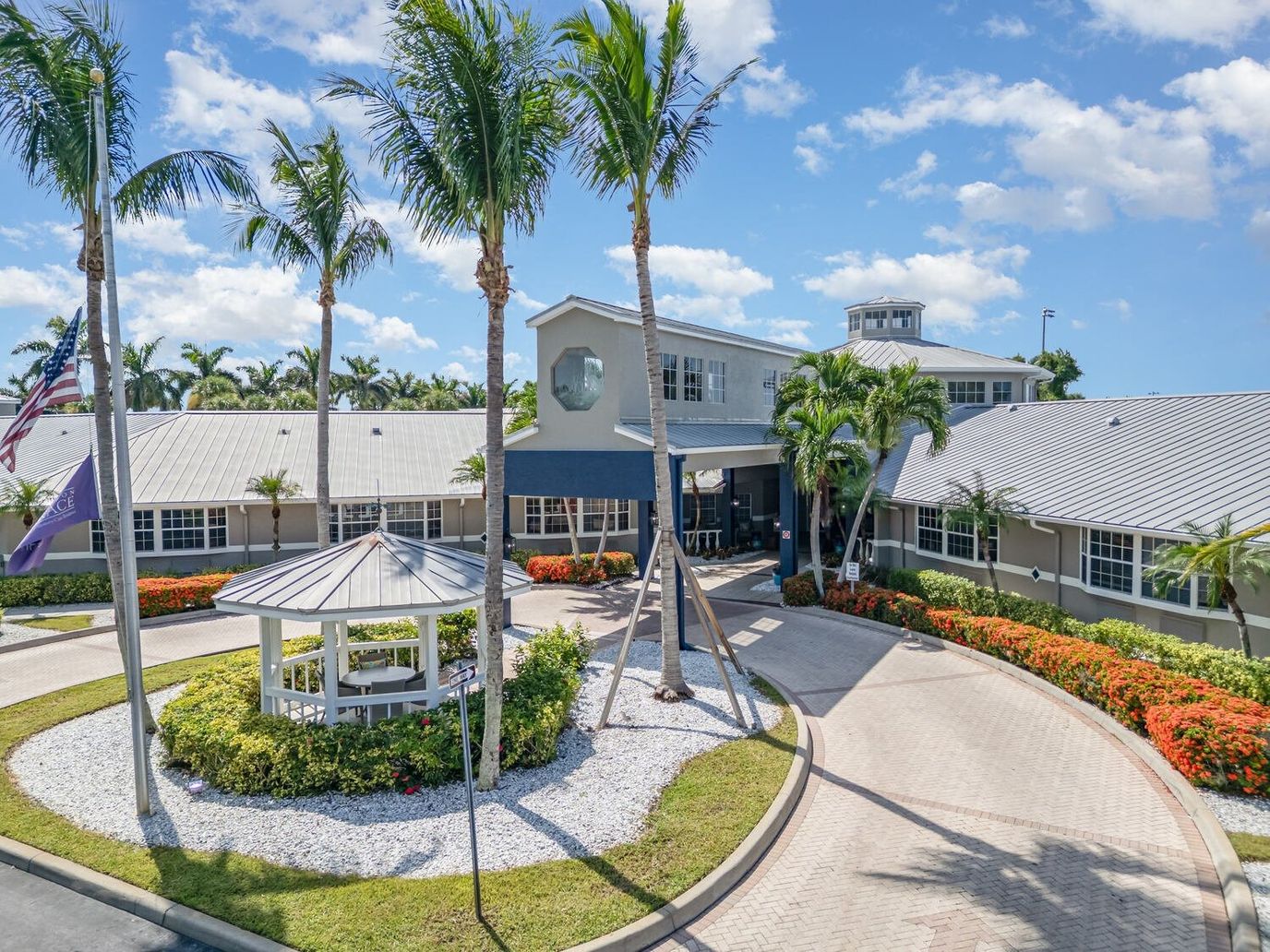 Exterior view of Barrington Terrace surrounded by palm trees