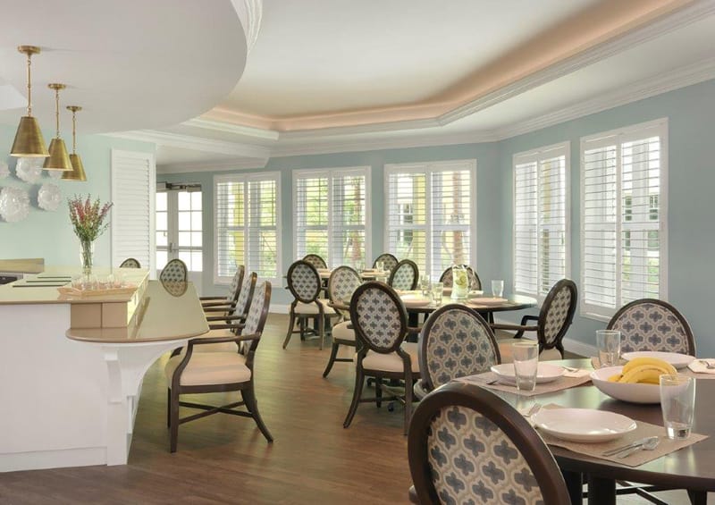 Bright dining room with tables set for meals