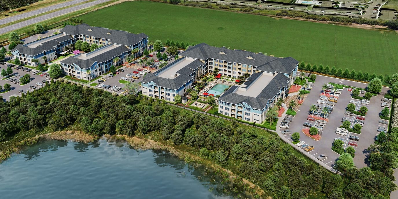 Aerial view of a senior living facility with landscaped grounds.