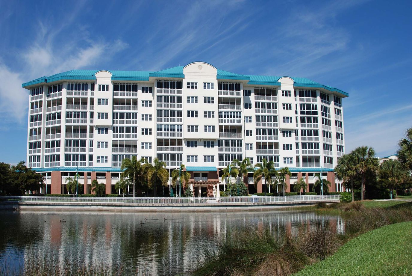 Exterior view of The Woodlands at Shell Point facing a lake