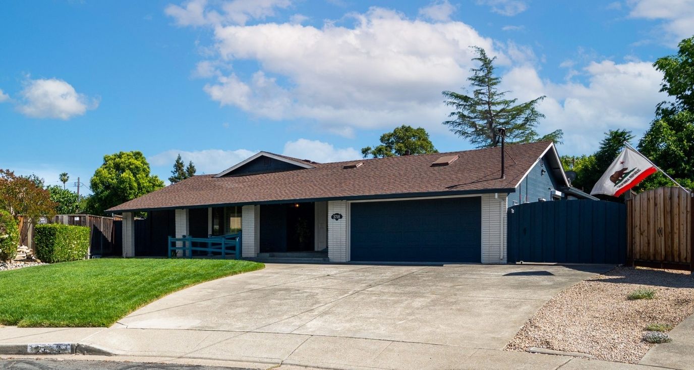 Exterior view of a single-story home with a lawn