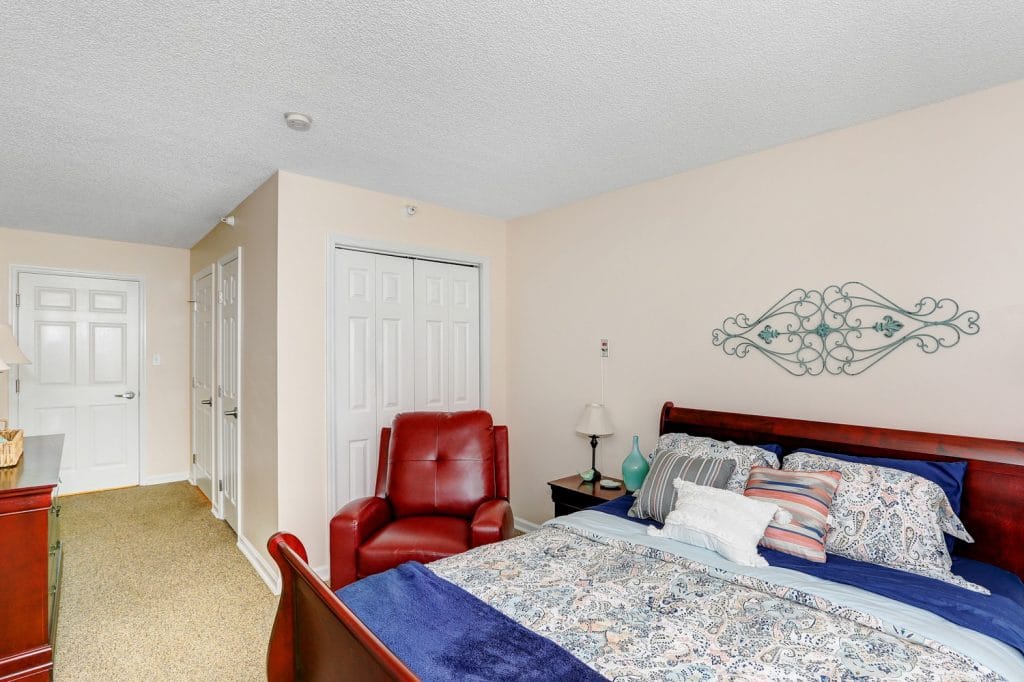 Cozy resident room with a bed and seating area