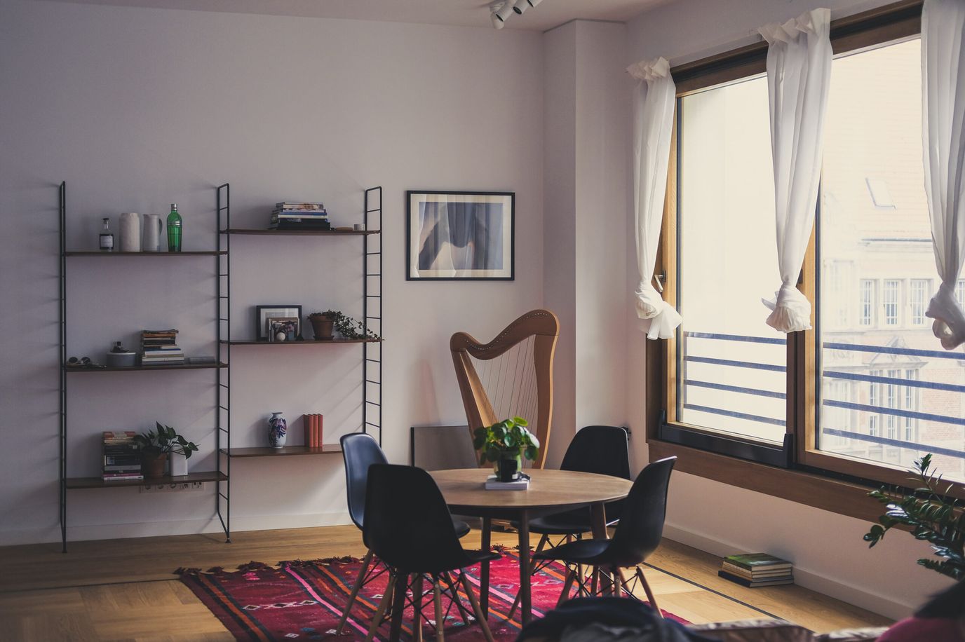 Bright and inviting common area with a table and plants