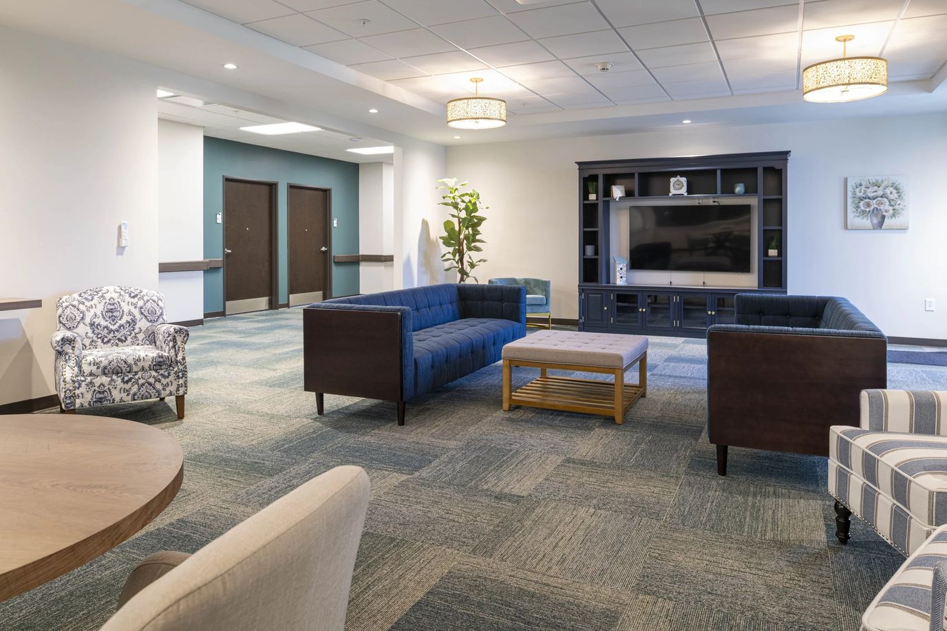 Bright common area with comfortable seating and television