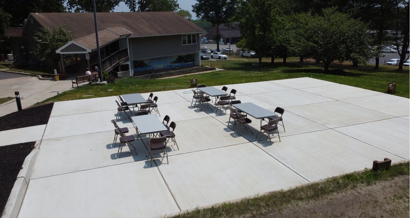 Outdoor seating area with tables and chairs