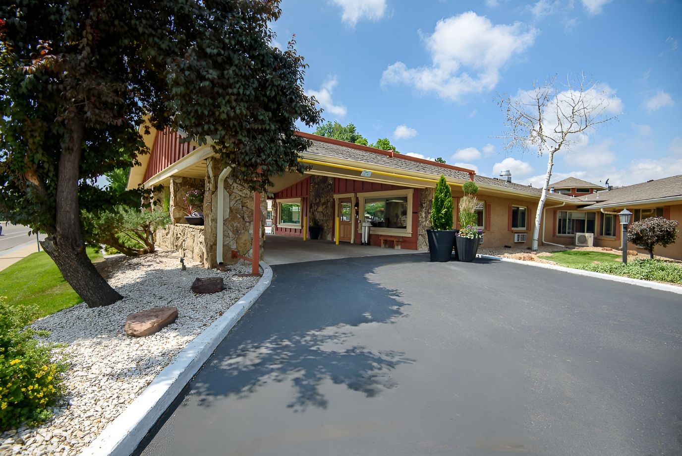 Entrance of Western Hills Health Care Center with landscaped driveway