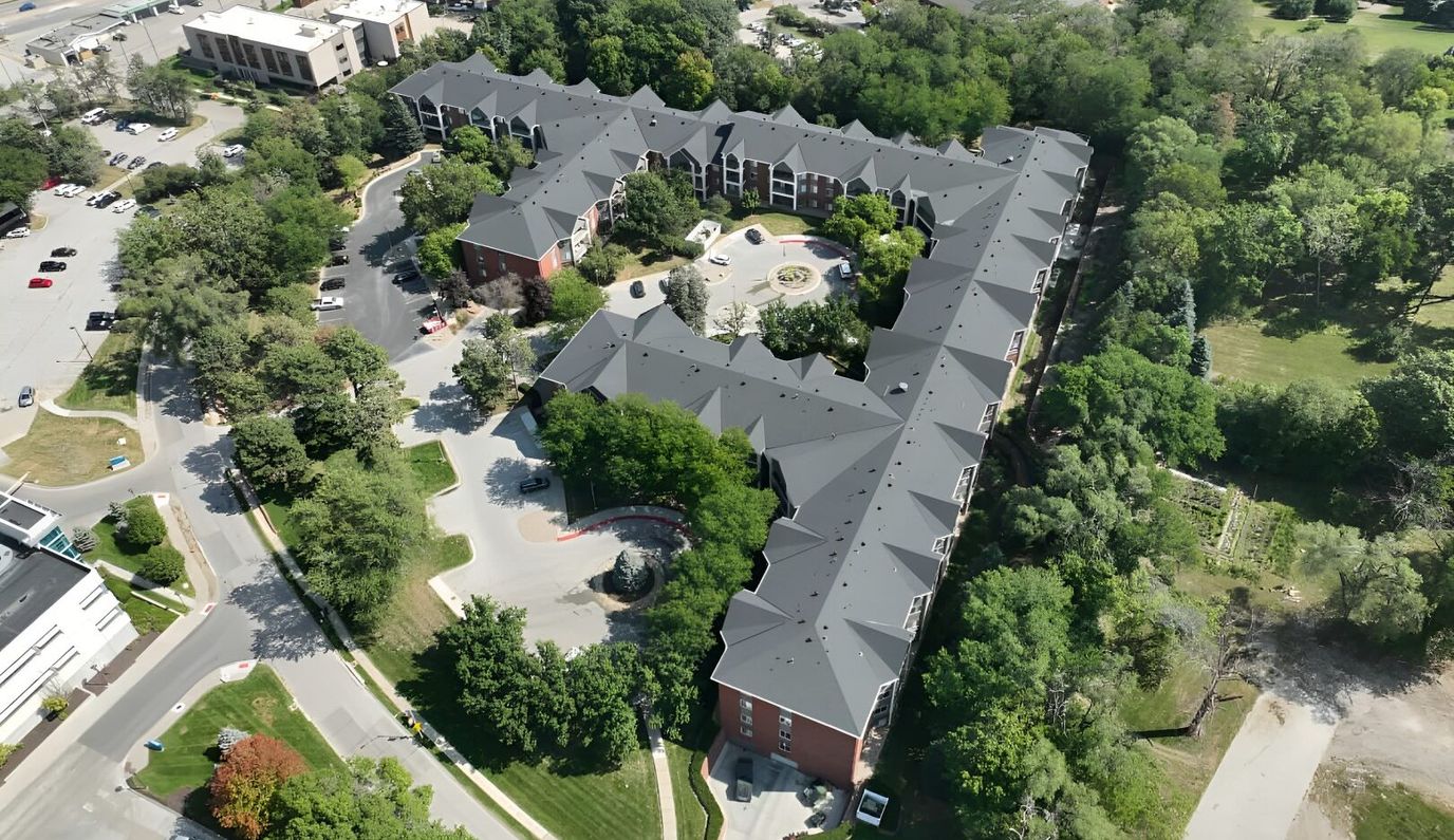Aerial view of the assisted living facility and surrounding greenery