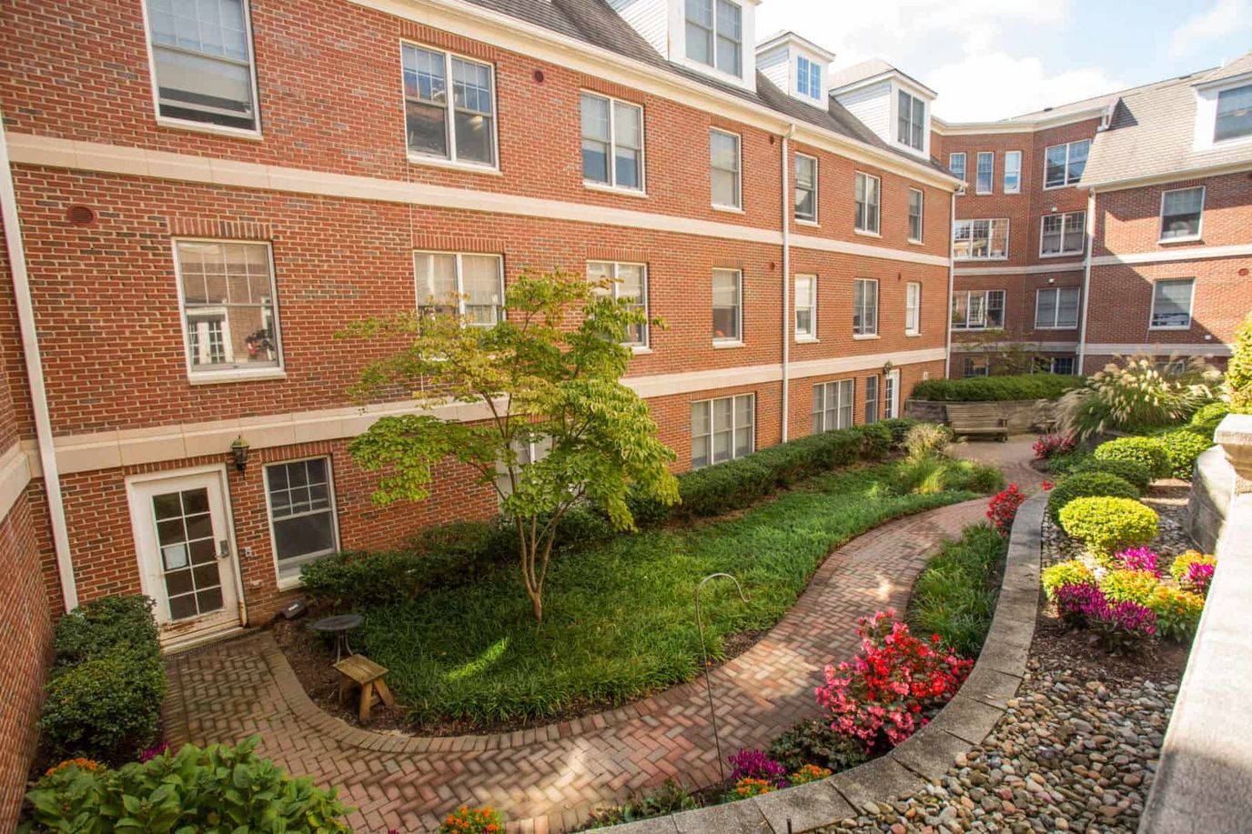 Garden area with flower beds beside the building