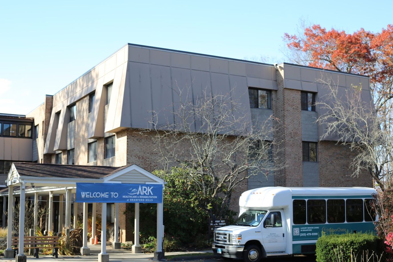 Exterior view of the facility building with a welcome sign