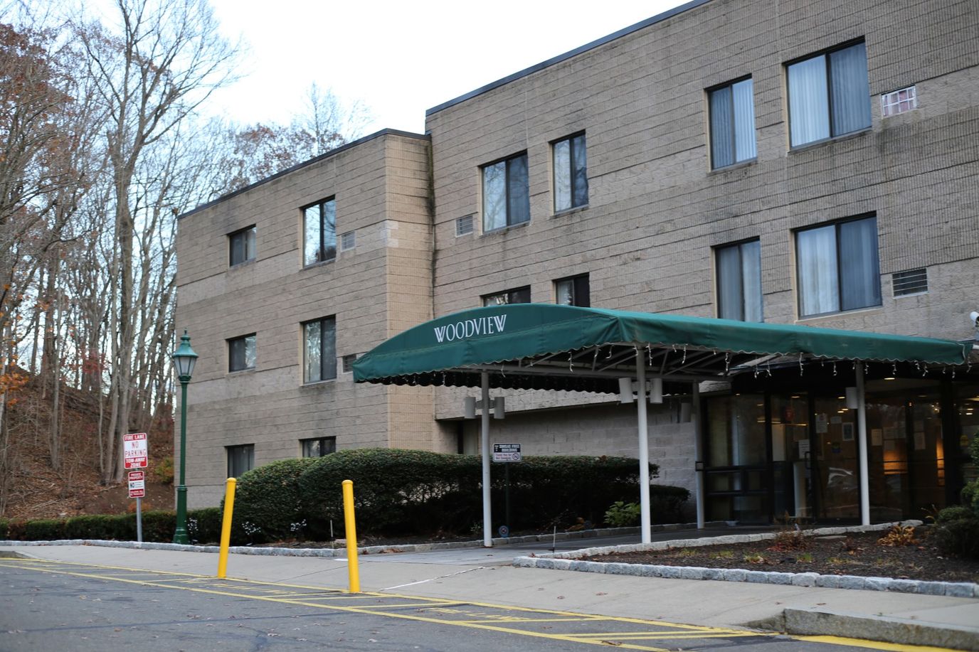 Exterior view of Woodview Elderly Housing with entrance