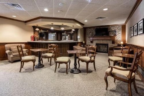 Cozy common area with seating and a fireplace