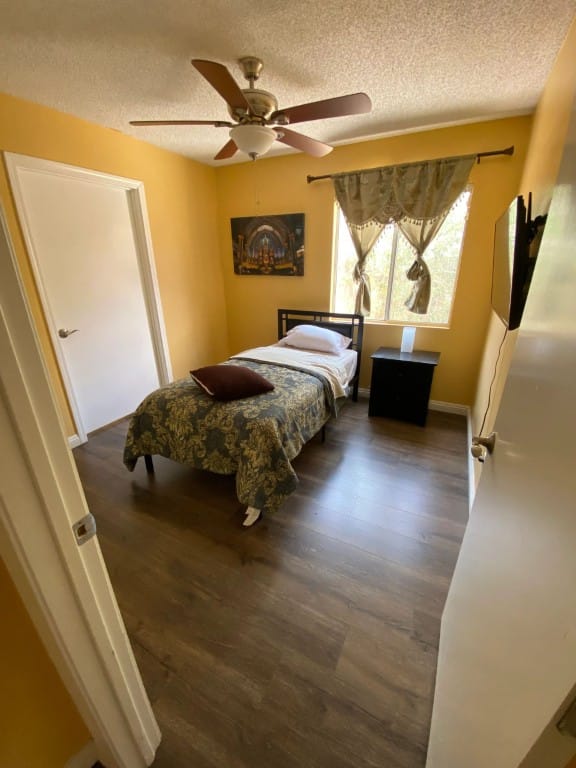 Cozy bedroom with a single bed and window