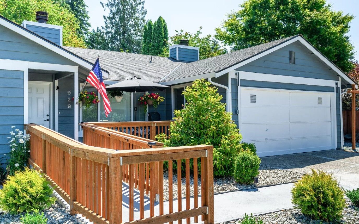 Exterior view of a senior living facility with a front porch.