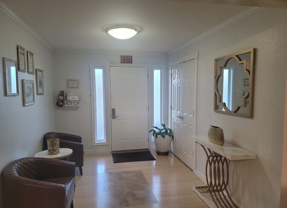 Bright interior hallway with seating and decor