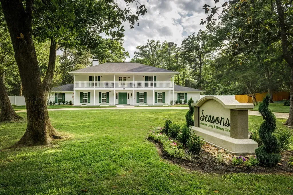 Exterior view of Seasons Assisted Living with landscaping