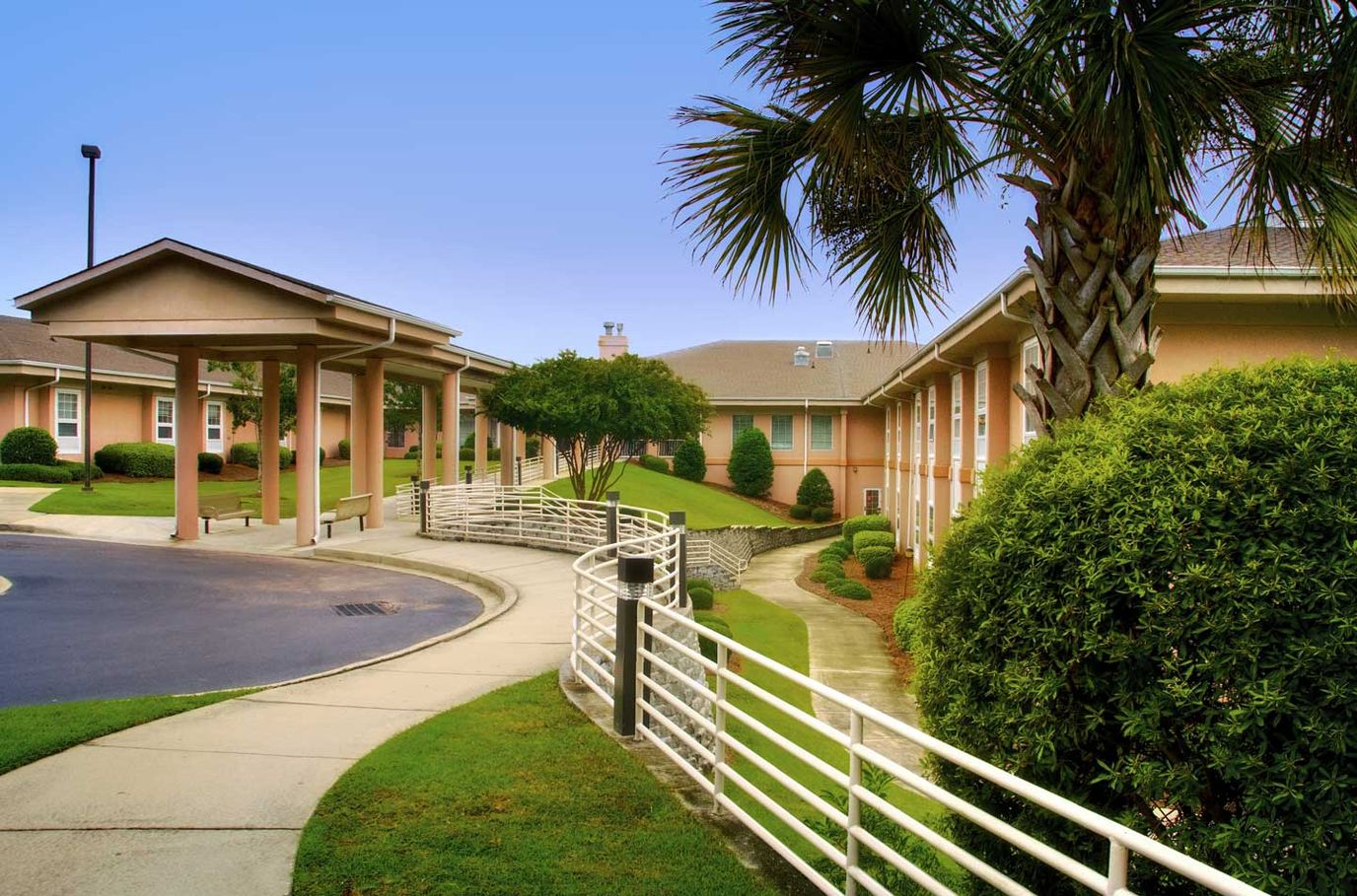 Exterior view of the facility with landscaped grounds