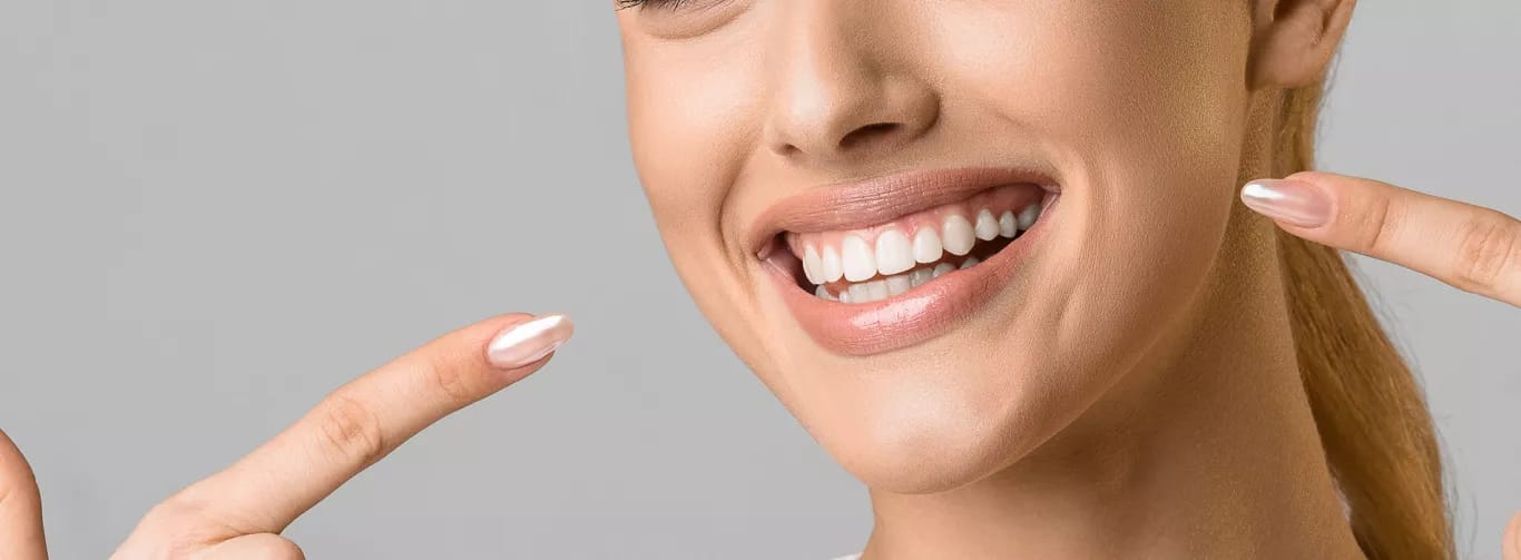Arabella Health & Wellness of Phenix City, Nursing Home in Phenix City, AL — Smiling woman showcasing her white teeth and nails